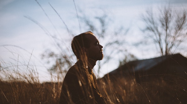 Techniques and Benefits of meditation-a man meditating outdoors