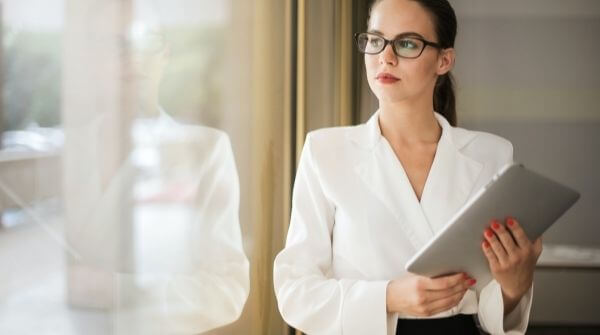 Women wearing clothes to show the right attire for interview. She is looking very professional and sophisticated.