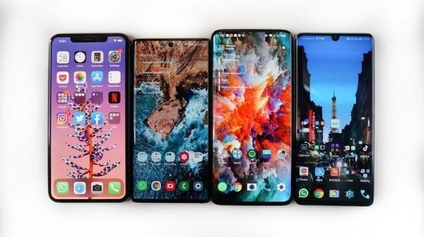 Various phones shown including iOS and Android operated devices and their display wallpaper is visible.